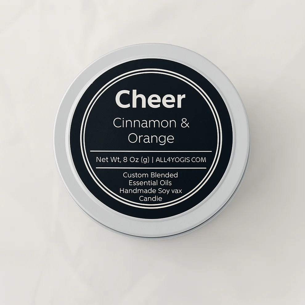 Cheer 8oz Tin Candle featuring custom blended cinnamon and orange essential oils for a calming atmosphere.
